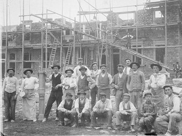 Group of workers on a construction site in the 1900s.