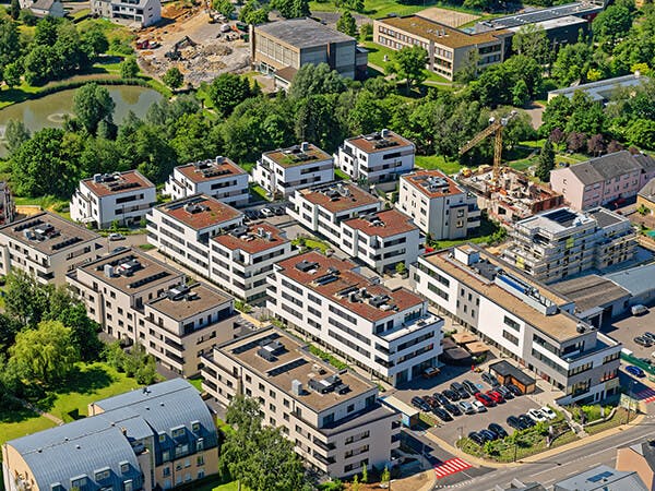 Entre 2016 et 2019 Félix Giorgetti et Kuhn Construction réalisent la phase 1 du nouveau quartier d’habitation Champs du soleil à Steinfort, qui compte 136 appartements.